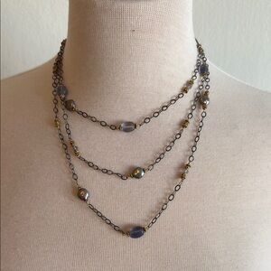 Elegant Multi-Layered Necklace with Gold and Silver Accents and Blue Gems